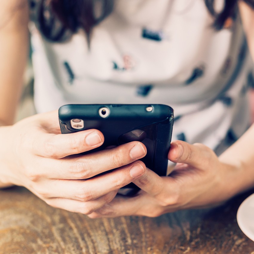 phone in a woman's hands. Close up